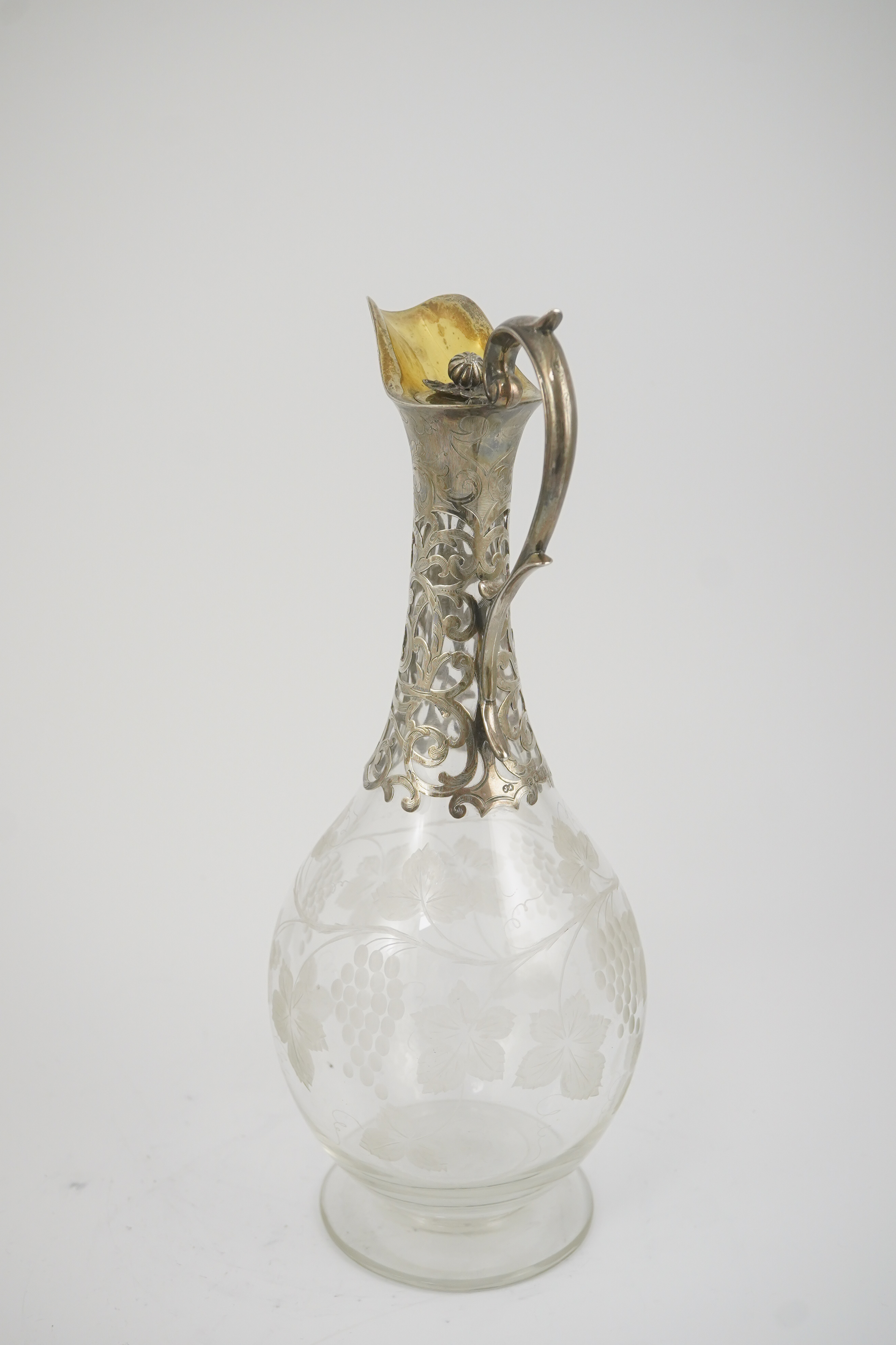 A Victorian parcel gilt silver mounted glass pyriform claret jug, by Joseph Angell II